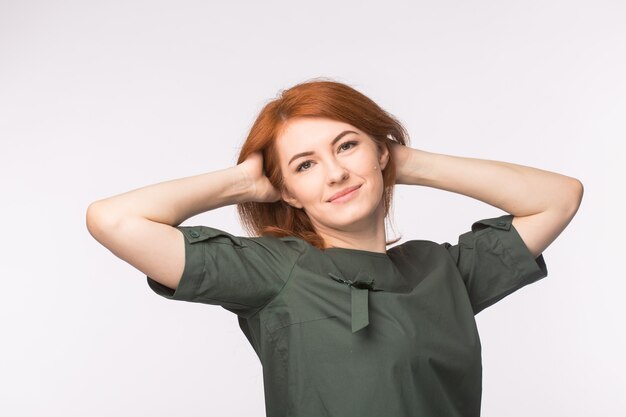 Young redhead woman posing.