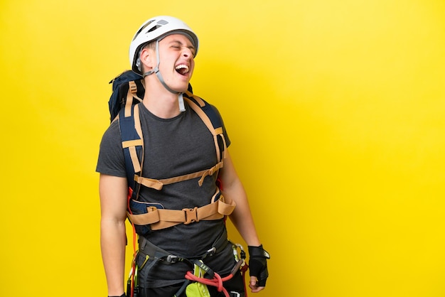 Young rock climber Brazilian man laughing