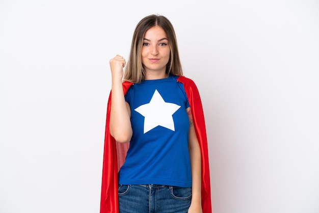 Young Romanian woman isolated on white background in superhero costume