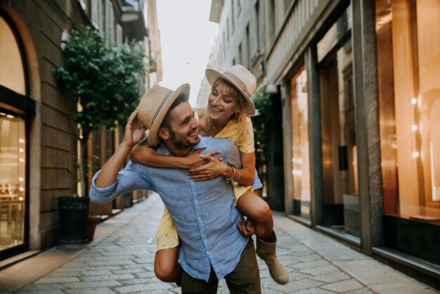 Young romantic couple in love having fun walking in the city