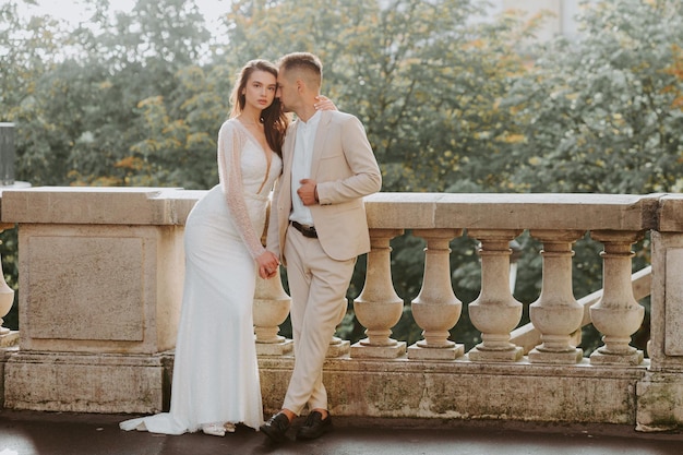 Young romantic couple standing in front of the Eiffel Tower