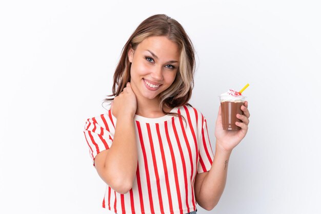 Young Russian girl holding cappuccino isolated on white background laughing