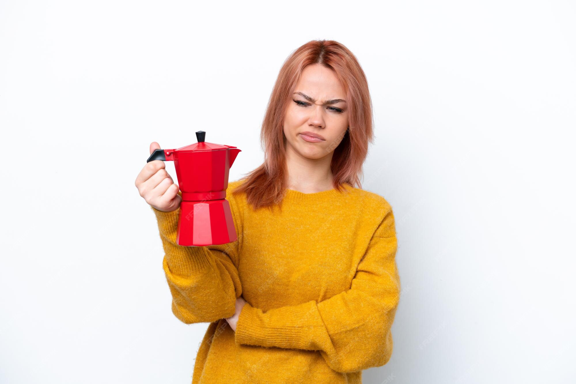 Premium Photo | Young russian girl holding coffee pot isolated on white  background with sad expression