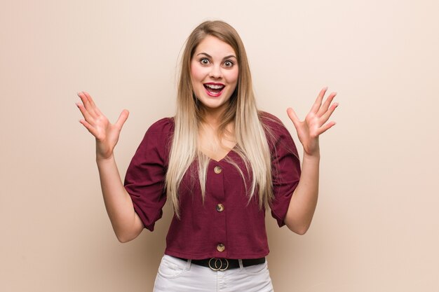 Young russian woman celebrating a victory or success