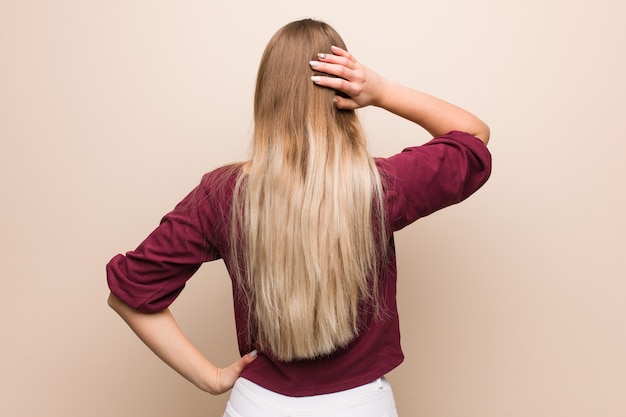 Young russian woman from behind thinking about something