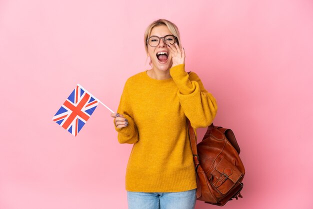 Young Russian woman holding an United Kingdom flag