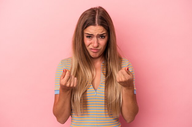 Young russian woman isolated on pink background being shocked, she has remembered important meeting