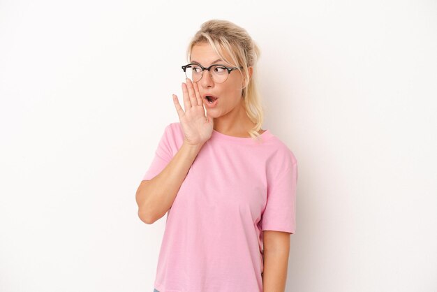 Young Russian woman isolated on white background being shocked because of something she has seen