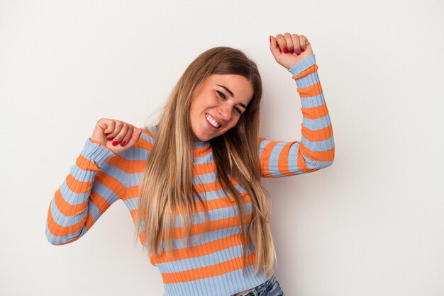 Young Russian woman isolated on white background celebrating a special day, jumps and raise arms with energy.