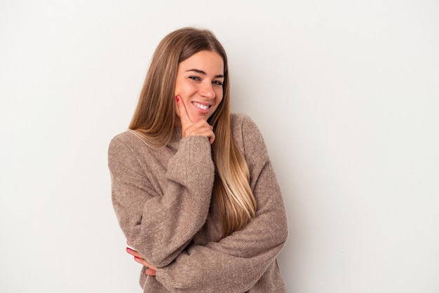 Young Russian woman isolated on white background cheering carefree and excited. Victory concept.