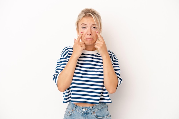 Young Russian woman isolated on white background crying unhappy with something agony and confusion concept