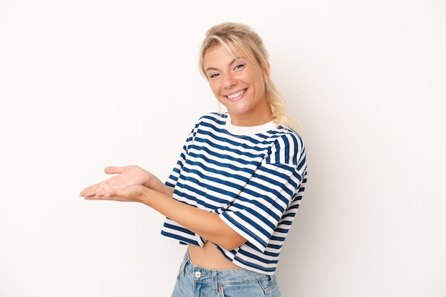 Young Russian woman isolated on white background holding a copy space on a palm.