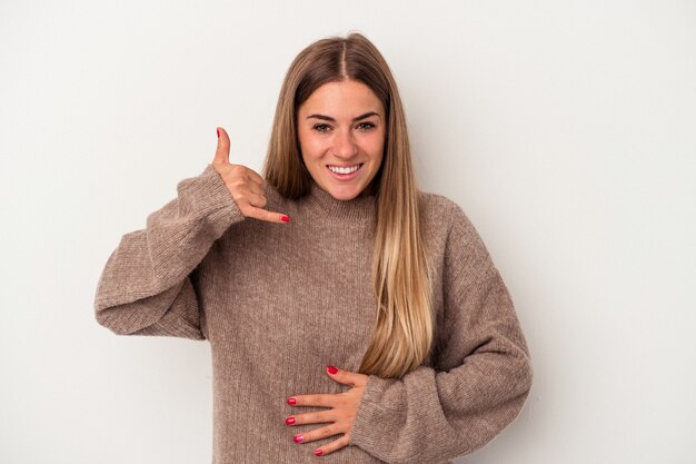 Young Russian woman isolated on white background looks aside smiling, cheerful and pleasant.