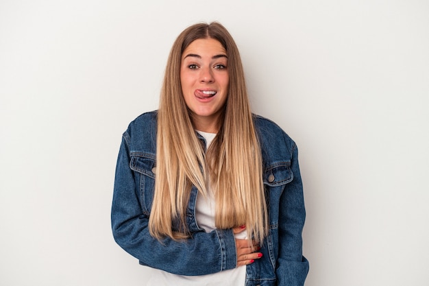 Young Russian woman isolated on white background looks aside smiling, cheerful and pleasant.