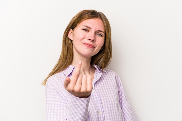 Young russian woman isolated on white background pointing with finger at you as if inviting come closer