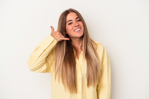 Young Russian woman isolated on white background showing a mobile phone call gesture with fingers.