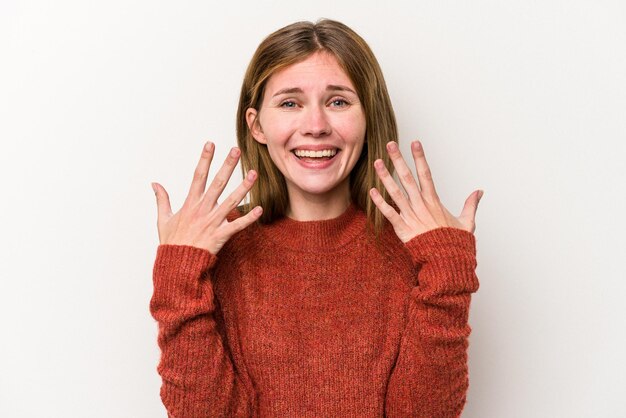 Young russian woman isolated on white background showing number ten with hands