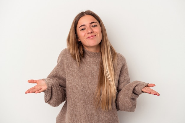 Young Russian woman isolated on white background showing okay sign over eyes