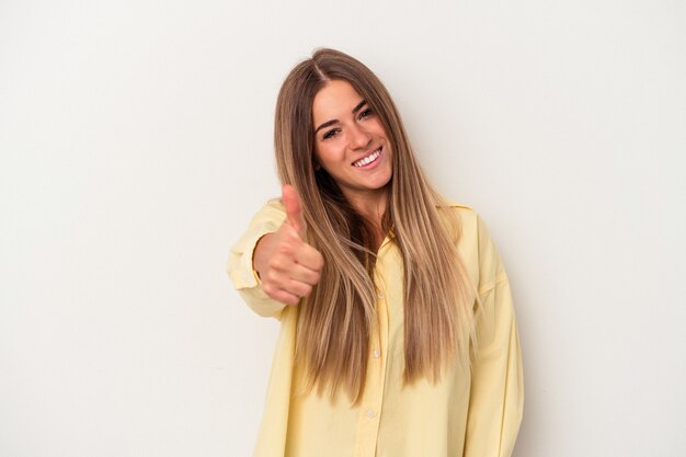 Young Russian woman isolated on white background smiling and raising thumb up