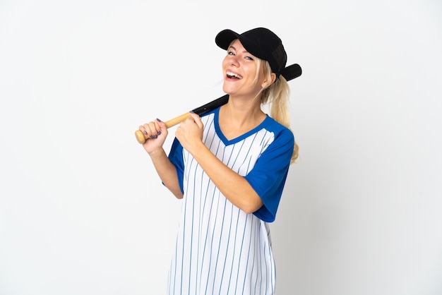Young Russian woman playing baseball isolated on white wall celebrating a victory