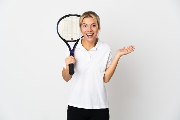 Young Russian woman tennis player isolated on white background with shocked facial expression