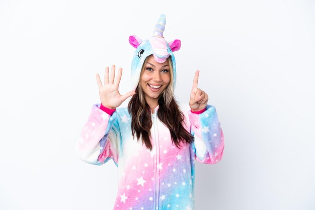 Young Russian woman wearing a unicorn pajama isolated on white background counting six with fingers