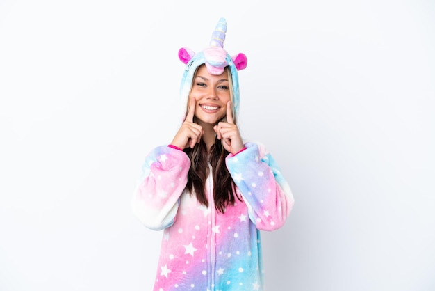 Young Russian woman wearing a unicorn pajama isolated on white background smiling with a happy and pleasant expression