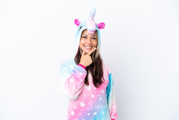 Young Russian woman wearing a unicorn pajama isolated on white background smiling