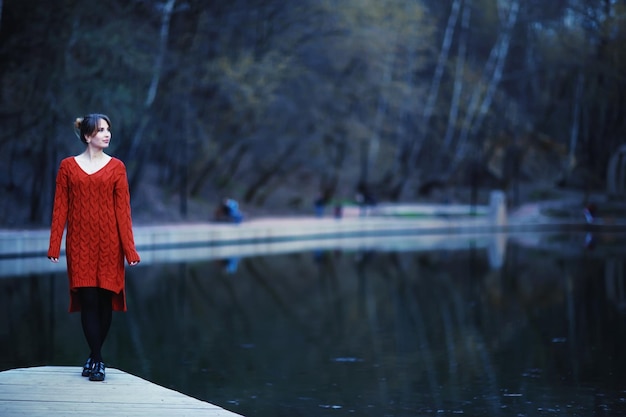 Young sad woman alone in a winter city