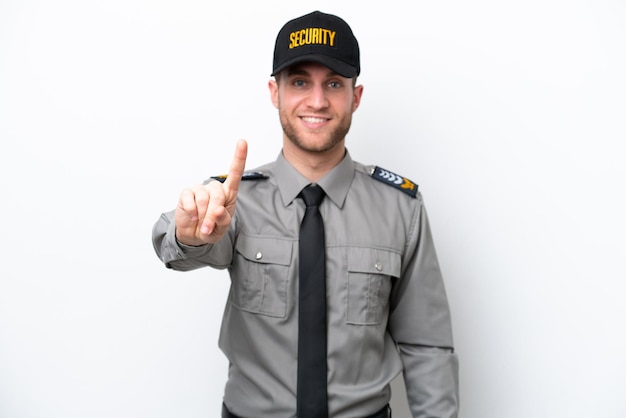 Young safeguard caucasian man isolated on white background showing and lifting a finger