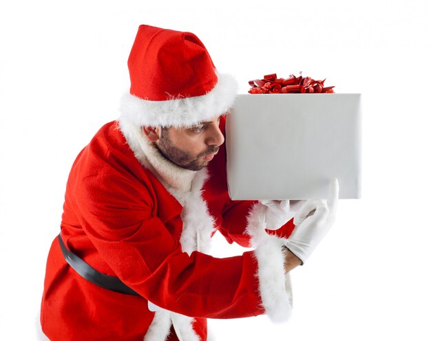 Young Santa Claus with gift box