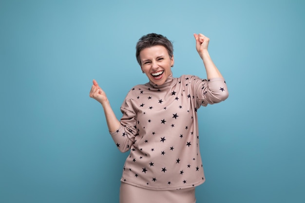 Young satisfied happy caucasian boss woman with short gray hair in skirt and blouse laughing out