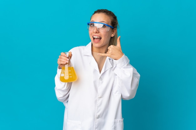 Young science woman isolated on blue