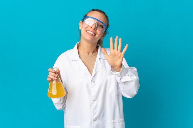 Young science woman isolated on blue