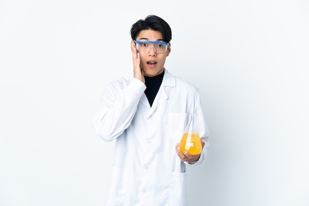 Young scientific man isolated with surprise and shocked facial expression