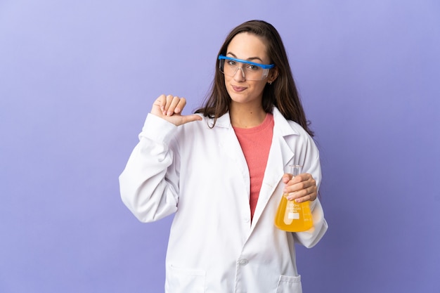 Young scientific woman over isolated background proud and self-satisfied