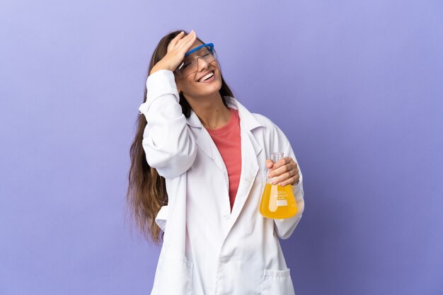 Young scientific woman over isolated background smiling a lot