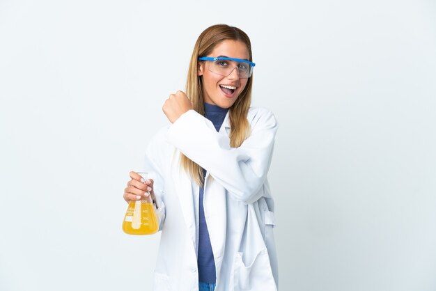 Young scientific woman isolated celebrating a victory