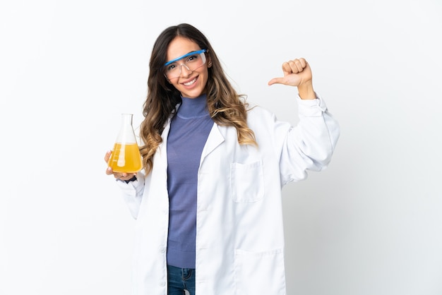 Young scientific woman posing isolated against the blank wall