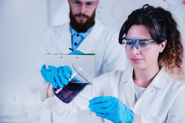 Young Scientist Doing Experiments In The Laboratory