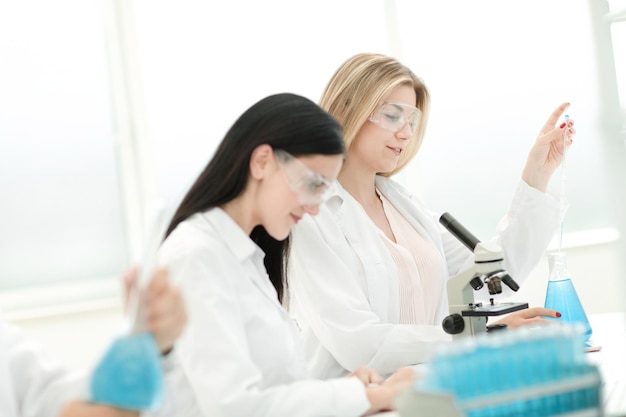 Young scientists are testing the liquid in the laboratory