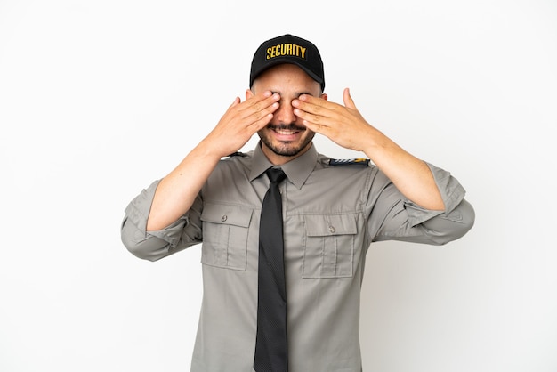 Young security  caucasian man isolated on white background covering eyes by hands