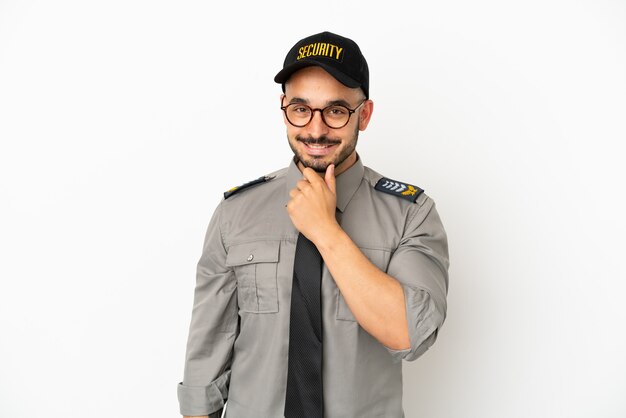 Young security  caucasian man isolated on white background with glasses and smiling