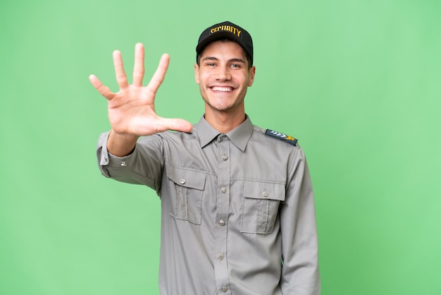 Young security man over isolated background counting five with fingers