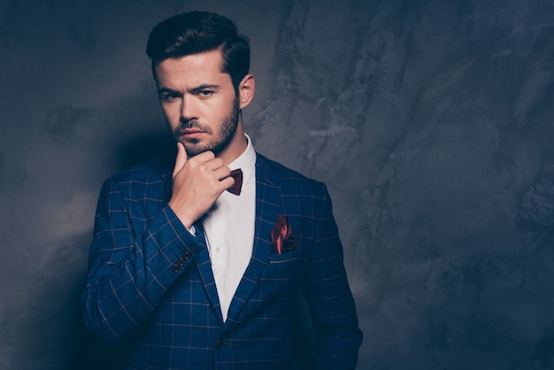 Young serious man wearing a formal suit