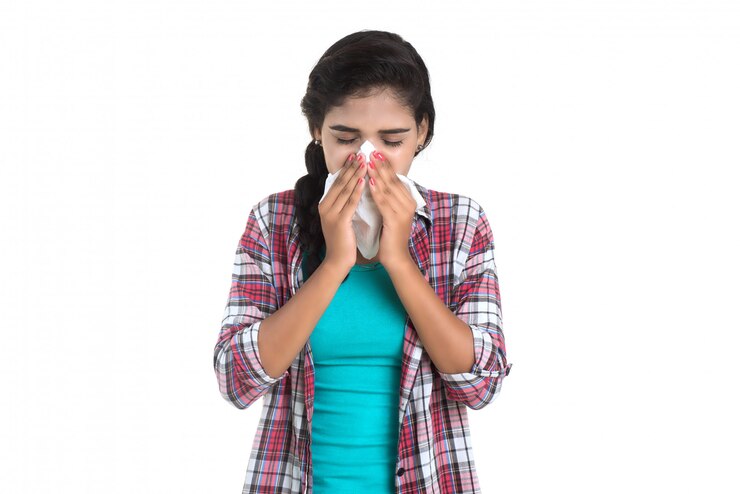फोटो young sick woman blowing her nose. allergic rhinitis. has fever. young woman with cold