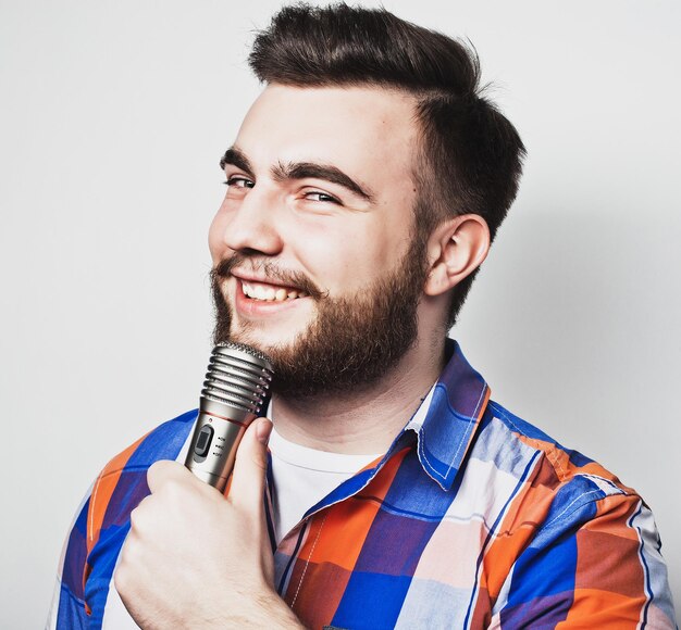 Photo young singer with microphone