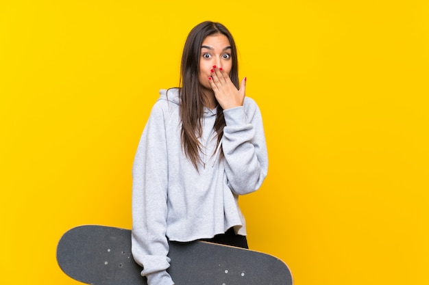 Young skater woman with surprise facial expression