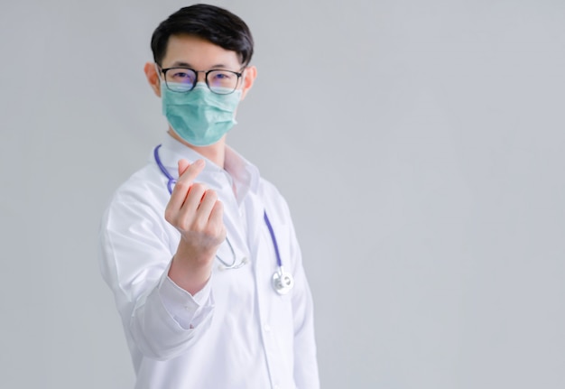 Young smart doctor wearing a face mask