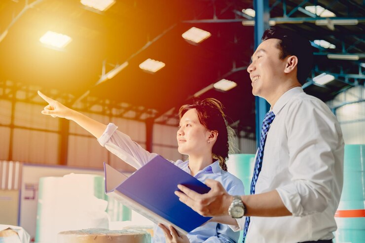 Young smart women standing hand pointing aim forward with man for business boss executive leader